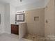 Updated bathroom with walk-in shower and double vanity at 9440 Wallace Pond Dr, Huntersville, NC 28078
