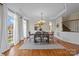 Bright dining room with hardwood floors and chandelier at 9440 Wallace Pond Dr, Huntersville, NC 28078