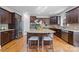 Island kitchen with granite countertops and stainless steel appliances at 9440 Wallace Pond Dr, Huntersville, NC 28078