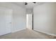 Unfurnished bedroom with neutral-colored carpet and an open doorway at 104 Helm Ln # C, Mooresville, NC 28117