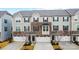 Three-story townhouses with stone accents and attached garages at 104 Helm Ln # C, Mooresville, NC 28117