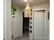 Bright hallway with two closed doors and a unique hanging light fixture at 110 Oak Crossing Dr, Shelby, NC 28152