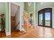 Grand entryway with a wooden staircase and double doors at 590 Tuckertown Rd, New London, NC 28127