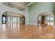 Spacious great room featuring hardwood floors, high ceilings, and a grand entryway at 590 Tuckertown Rd, New London, NC 28127