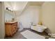 Unique bathroom with clawfoot tub and antique vanity at 590 Tuckertown Rd, New London, NC 28127