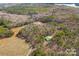 Aerial view of property showcasing expansive acreage and a secondary building at 590 Tuckertown Rd, New London, NC 28127