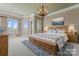 Luxurious main bedroom with a king-size bed and plenty of natural light at 590 Tuckertown Rd, New London, NC 28127