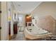 Bathroom boasts a large jetted tub and tile flooring at 590 Tuckertown Rd, New London, NC 28127