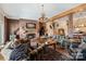 Living room with a fireplace, comfortable seating, and a rustic feel at 590 Tuckertown Rd, New London, NC 28127