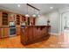 Basement wet bar with wooden cabinetry and granite countertop at 590 Tuckertown Rd, New London, NC 28127