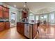 Gourmet kitchen boasting wood cabinets, granite countertops, and an island at 590 Tuckertown Rd, New London, NC 28127
