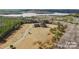 Luxury home on a large lot with a lake in the background at 590 Tuckertown Rd, New London, NC 28127
