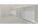 Large walk-in closet with built-in shelving and hanging rods at 590 Tuckertown Rd, New London, NC 28127