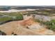 Aerial view shows home's location on a large lot near lake at 590 Tuckertown Rd, New London, NC 28127