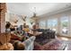 Spacious living room with a fireplace and large windows at 590 Tuckertown Rd, New London, NC 28127