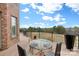 Deck with glass-top table and chairs overlooks scenic view at 590 Tuckertown Rd, New London, NC 28127