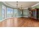 Elegant dining room with hardwood floors and large windows offering scenic views at 590 Tuckertown Rd, New London, NC 28127