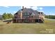 Large brick home with expansive deck and beautiful landscaping at 590 Tuckertown Rd, New London, NC 28127