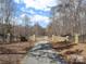 Stone pillars and metal gate entrance to a private property at 590 Tuckertown Rd, New London, NC 28127