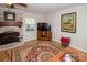 Bright living room with hardwood floors, fireplace, and large artwork at 10933 Hunter Trail Ln, Charlotte, NC 28226