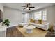 Living room with white couch, coffee table, and hardwood floors at 1428 Boxwood Ave, Lancaster, SC 29720