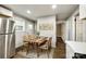 Kitchen dining area with wooden table and four chairs at 1428 Boxwood Ave, Lancaster, SC 29720