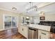 Modern kitchen with an island, stainless steel appliances, and granite countertops at 4225 Cheshire Glen Dr, Monroe, NC 28110