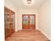 Bright foyer with hardwood floors and double French doors at 6405 Highway 205 Hwy, Marshville, NC 28103