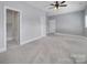 Spacious bedroom with ensuite bathroom and ceiling fan at 1017 N Sharon Amity Rd, Charlotte, NC 28211