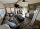 Open living room with kitchen and sectional sofa at 104 Cardinal Ave, New London, NC 28127