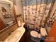 Bathroom with shower/tub combo and beach-themed decor at 104 Cardinal Ave, New London, NC 28127