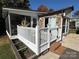 Charming home exterior with stone accents and deck at 104 Cardinal Ave, New London, NC 28127