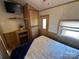 Cozy bedroom with double bed and built-in shelves at 104 Cardinal Ave, New London, NC 28127