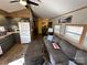 Open living area with kitchen, seating, and wood-look floors at 104 Cardinal Ave, New London, NC 28127