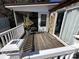 Spacious deck with screened porch, perfect for relaxing outdoors at 104 Cardinal Ave, New London, NC 28127