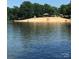 Sandy beach with gazebo and ample room for relaxation at 104 Cardinal Ave, New London, NC 28127