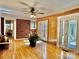 Living room with brick accent wall and hardwood floors at 111 Little River Church Rd, Taylorsville, NC 28681