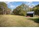 Spacious backyard with shed and trees at 131 E Branch Ave, Shelby, NC 28152