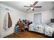 Bright bedroom with wood floors, ceiling fan, and ample closet space at 131 E Branch Ave, Shelby, NC 28152