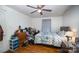 Cozy bedroom featuring a ceiling fan and wood floors at 131 E Branch Ave, Shelby, NC 28152