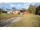Brick ranch home with a long driveway and a spacious yard at 131 E Branch Ave, Shelby, NC 28152