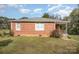 Brick ranch home with a covered porch and large yard at 131 E Branch Ave, Shelby, NC 28152