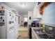 Bright kitchen with white cabinets and stainless steel appliances at 131 E Branch Ave, Shelby, NC 28152