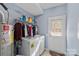 Laundry room with washer, dryer, and extra storage at 5313 Dockery Dr, Charlotte, NC 28209