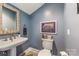 Powder room with pedestal sink and decorative mirror at 235 Dashers Den None, Fort Mill, SC 29708