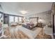 Main bedroom with a king-size bed, two armchairs, and hardwood floors at 1921 Leesburg Dr, Clover, SC 29710