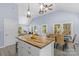 Open concept kitchen and dining area with butcher block island at 480 Wyatt Grove Church Rd, Gold Hill, NC 28071