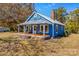 Quaint blue house, featuring a front porch and yard at 480 Wyatt Grove Church Rd, Gold Hill, NC 28071