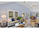 Open concept living space with large windows and a view of the dining area at 480 Wyatt Grove Church Rd, Gold Hill, NC 28071