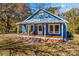 Charming blue house with a spacious front porch at 480 Wyatt Grove Church Rd, Gold Hill, NC 28071